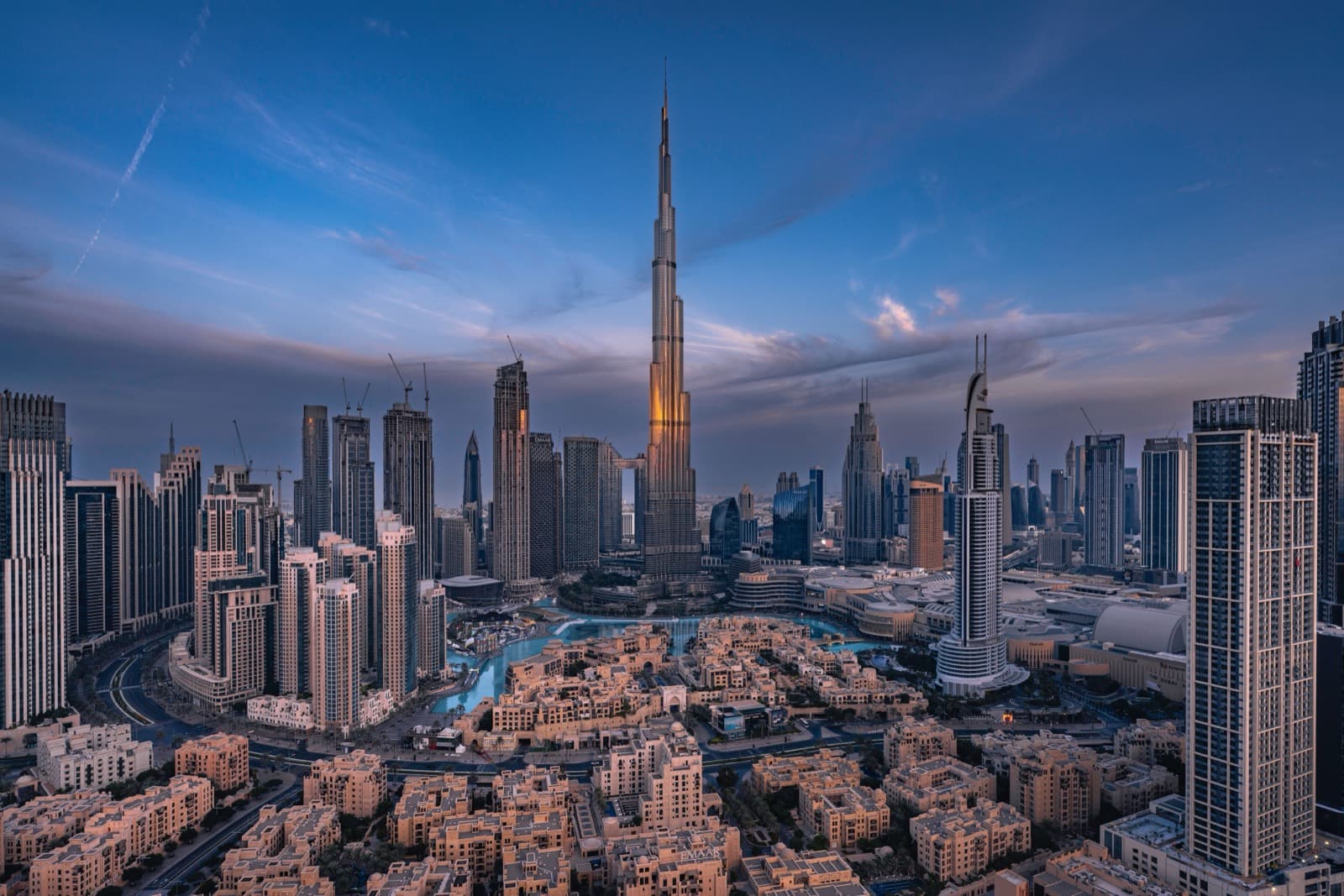 Completed Downtown Dubai skyline at dusk, with the Burj Khalifa and the fountain lake